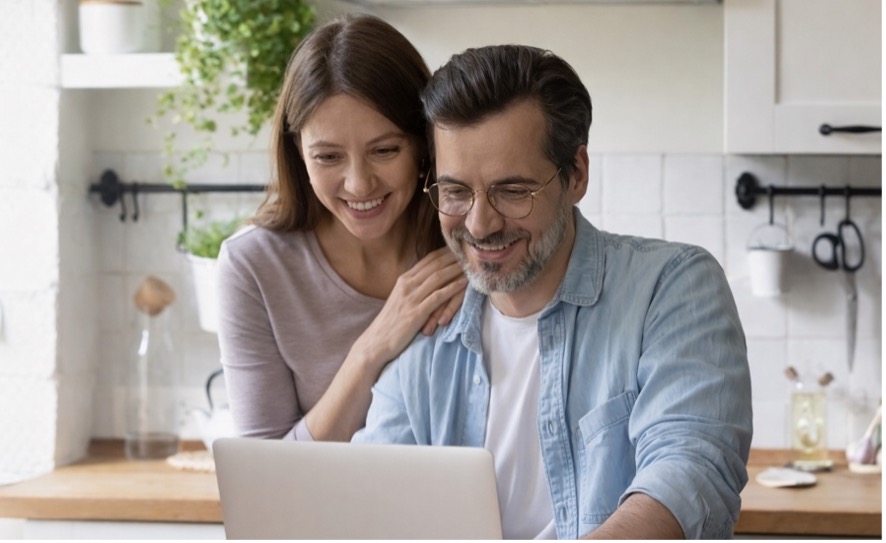 Couple reviewing applicant reports